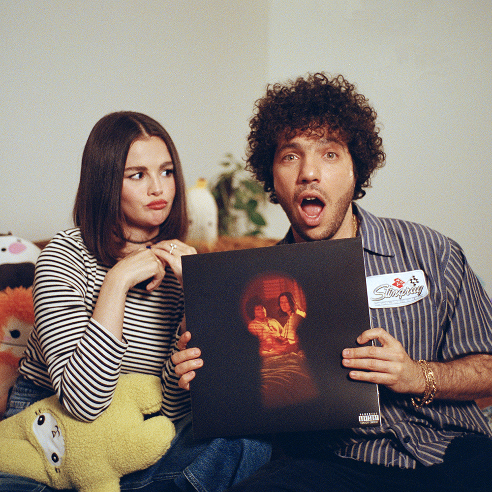 Selena and Benny holding I Said I Love You First (Candy Cane Red LP)