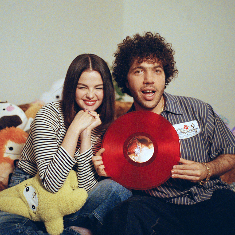 Selena and Benny holding I Said I Love You First (Candy Cane Red LP) alternative